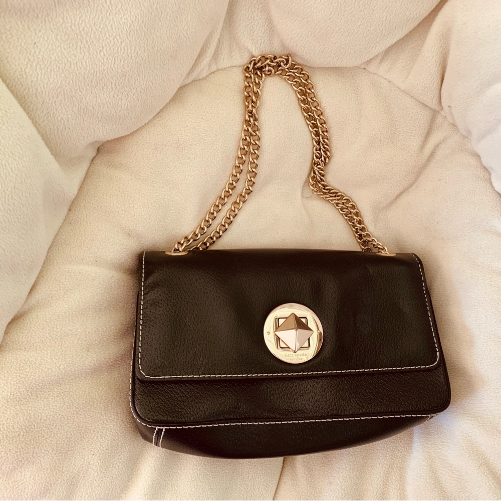 A black Kate Spade crossbody bag.